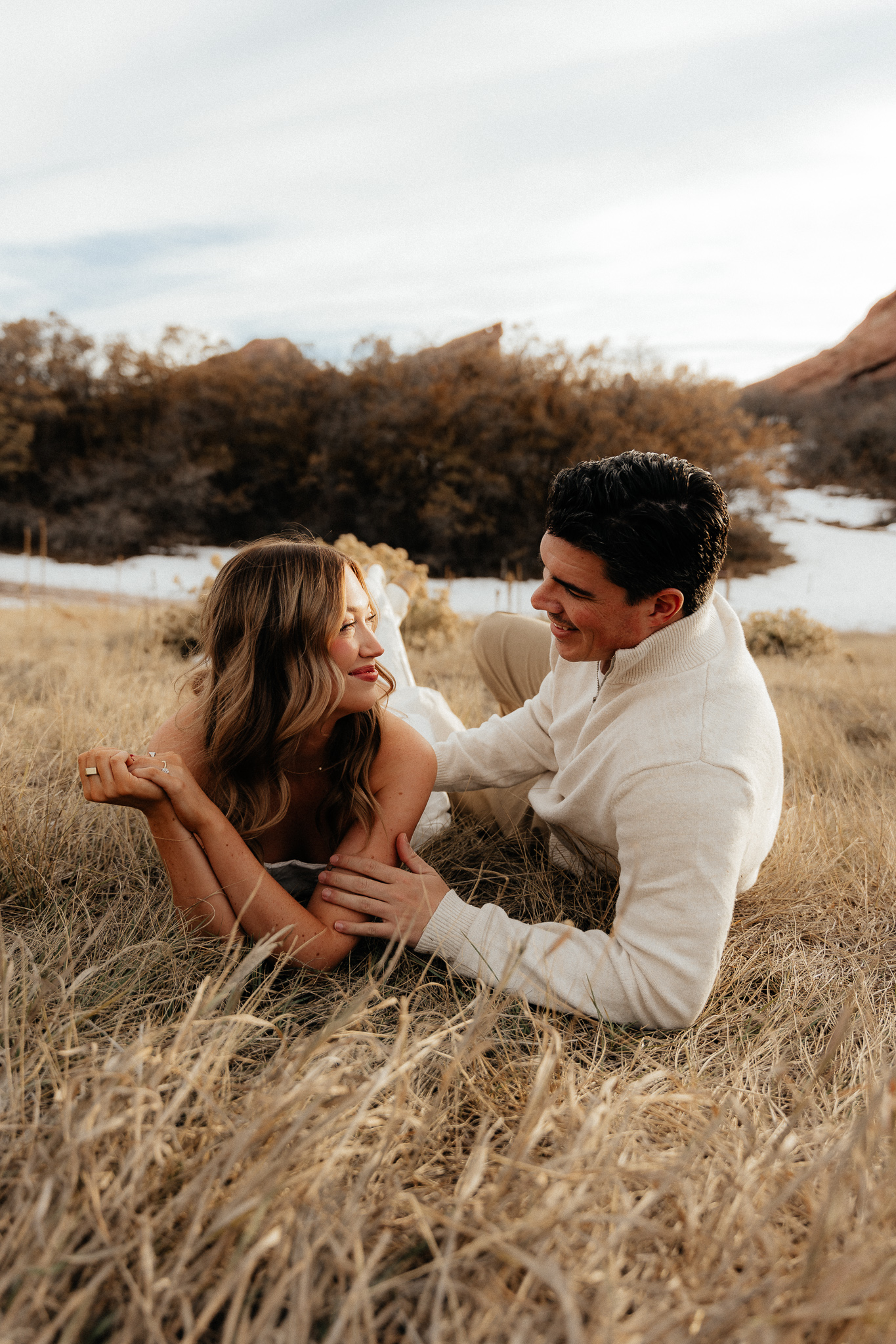 Playful couples in the foothills of the Colorado Rocky Mountains with Red Rocks