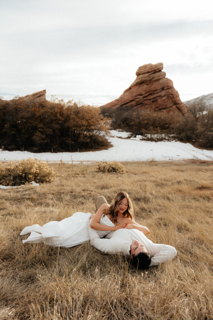 golden hour engagement photos in the fall with red rocks