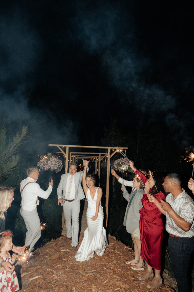 sparkler exit at wedding in mountains in summer